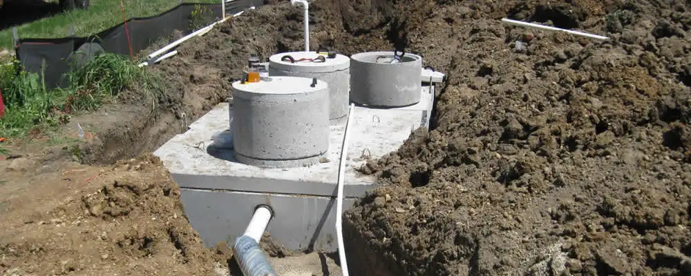 Septic system repair and installation site with tank access ports in Cape Coral, FL