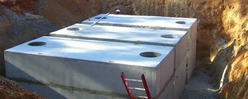 Septic tank installation site with a newly placed concrete tank in Cape Coral, FL
